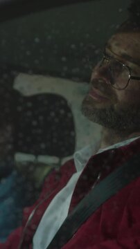 Driving through rain, Closeup of motorist experiencing contemplative mood amid rainy urban surroundings