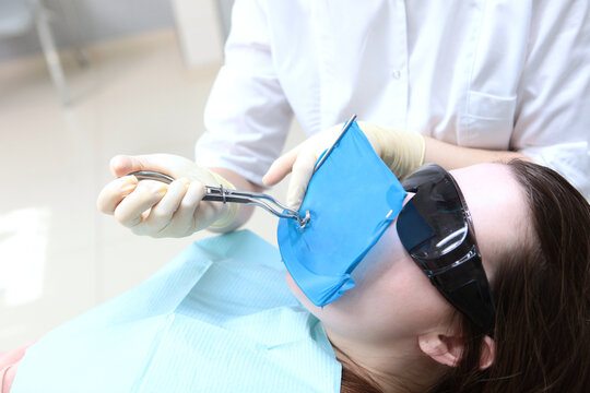 Protection of soft tissues of oral cavity from contact with instruments using cofferdam. Installing cofferdame. Isolation of one or more teeth before procedure. Comfort during dental treatment.