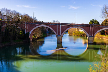 Obraz premium Pont Neuf crossing the Hers river in Mazères, Occitanie, France