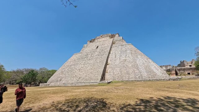 Uxmal pyramid ruins in M&eacute;rida Mexico under clear blue sky timelapse video