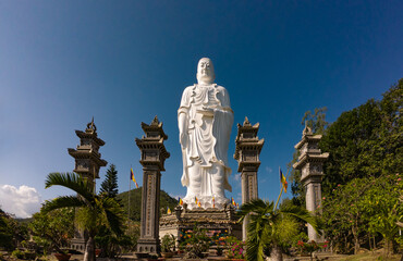 Standing Buddha statue against sky at Tong Lam Son Temple Nha Trang Vietnam