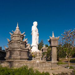 Standing Buddha statue against sky at Tong Lam Son Temple Nha Trang Vietnam