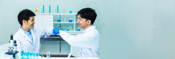 Banner Two asian scientist team reserch chemistry science tube experiment biotech antibody...