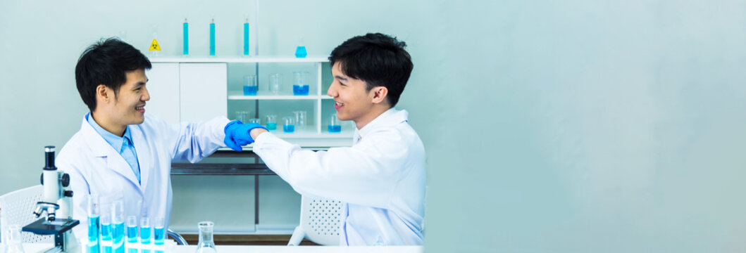 Banner Two asian scientist team reserch chemistry science tube experiment biotech antibody laboratory Cultivate Vaccine against virus. Two Scientist consulting Chemistry Laboratory with copy space