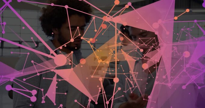 Two men pointing at device in office, reviewing tech while animated nodes sweeping and hiding faces