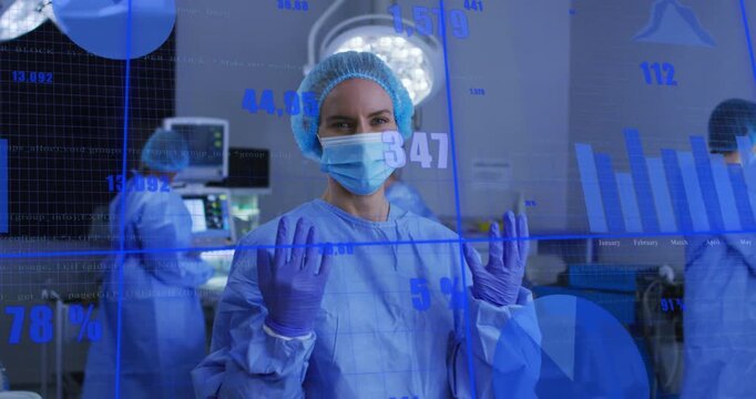 Vertical video: Surgeon holding glove prepping surgery, live data overlaying blue charts on hands