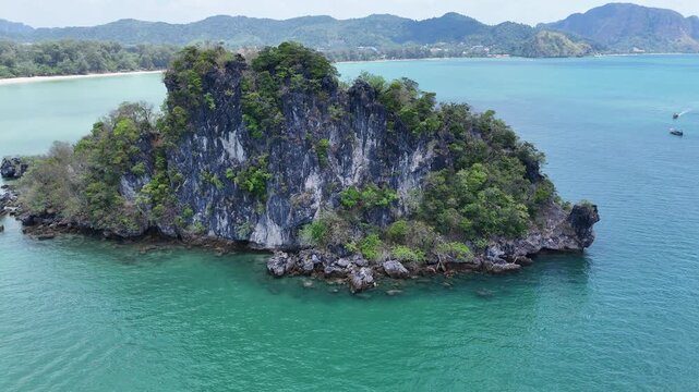 Drone shot circling tropical island at Hat Noppharat Thara Thailand with turquoise sea white sand beach and scenic coastline 4K