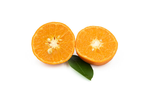 Slces of a cut Murcott mandarin orange, a type of citrus fruit known for its thin, easy-to-peel rind and sweet, juicy segments