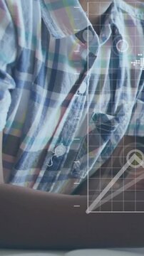Vertical video: Camera framing torso woman sitting arm resting HUD pulsing marking buttons for tech