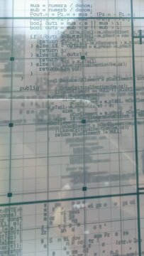 Vertical video: Woman moving phone, causing code scrolling on glass, revealing focus and reflection