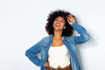 young woman with afro hair isolated on background laughing out loud