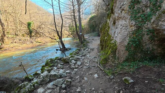 Walking Along Turquoise River With Tall Rock Wall. Ozren Mountain, Sokobanja region. Balkans, Serbia.