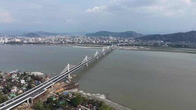 Aerial view of Kumar Bhaskar Varma Setu extradosed bridge over Brahmaputra river, Guwahati, Assam, India