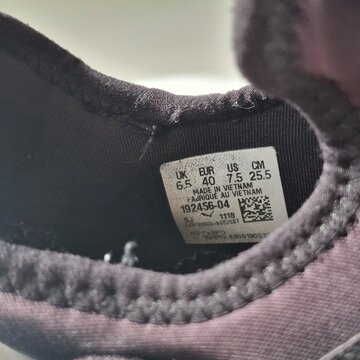Pair of Puma Running Shoes on Neutral Background