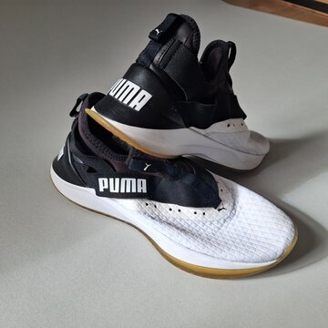 Pair of Puma Running Shoes on Neutral Background