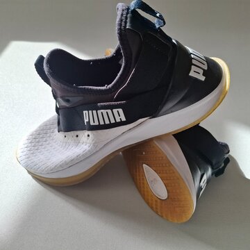Pair of Puma Running Shoes on Neutral Background