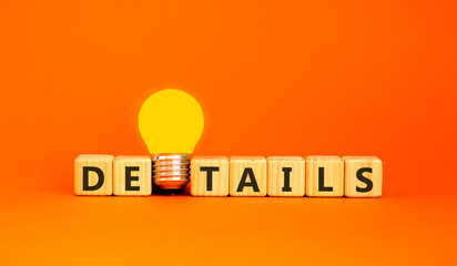Details detail symbol. Concept word Details on beautiful wooden blocks. Beautiful orange background. Beautiful yellow light bulb. Business details concept. Copy space.