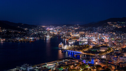 Fototapeta premium Magical hour night view of Nagasaki city and harbor from Mt. Nabekanmuri Park.