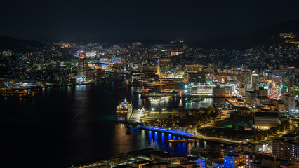Fototapeta premium Magical hour night view of Nagasaki city and harbor from Mt. Nabekanmuri Park.