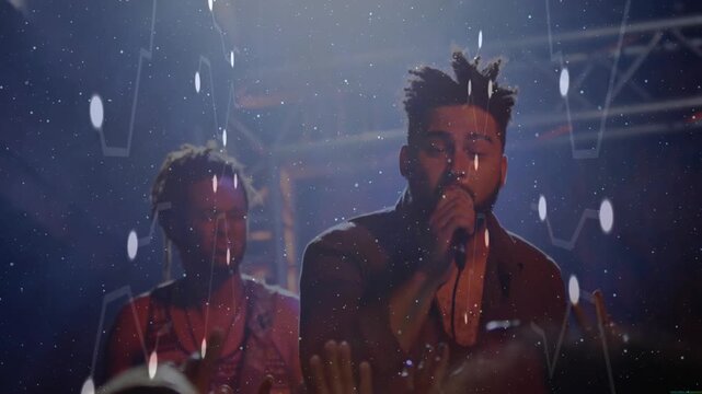 Lead singer holding microphone and performing under concert lights while overlays amplifying energy