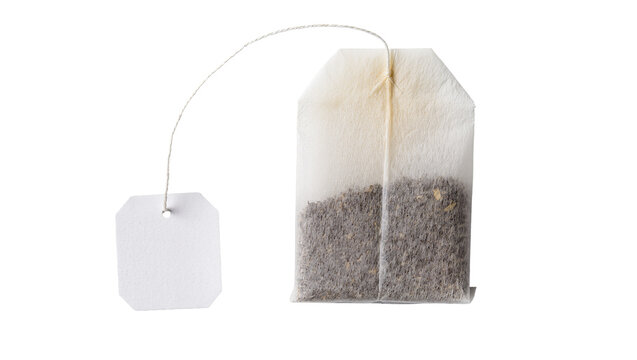 Isolated dry rectangular tea bag with blank paper label and string, ready to brew a hot drink.