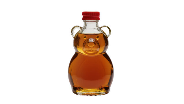 Isolated classic bear shaped glass bottle filled with delicious golden sweet maple syrup and red cap