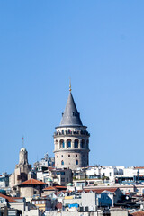 Naklejka premium Medieval stone tower and urban rooftops in the Galata neighborhood