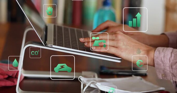 Animation of multiple icons over cropped hands of caucasian woman typing on keyboard