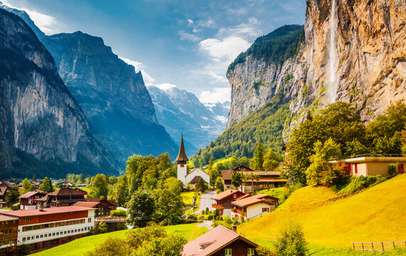 Charming alpine village in the Lauterbrunnen valley on a sunny day. Location place Bernese Alps, Switzerland, Europe.