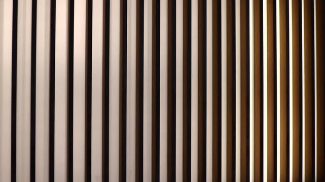 Abstract wooden vertical slats with soft lighting and gradient in slow motion. Suitable for background, interior design, luxury and modern architectural video concepts.