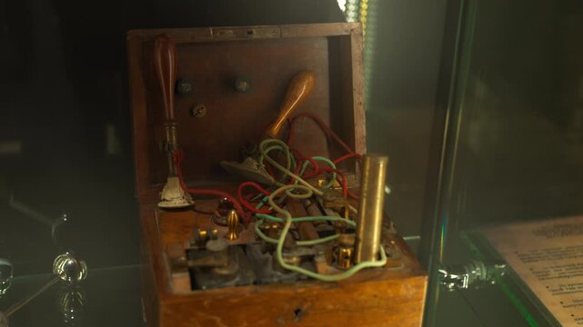 Antique medical laboratory with wooden box with electric appliance.
