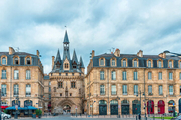 Fototapeta premium Bordeaux city with Porte Cailhau historic medieval gate and surrounding classical architecture, Gironde, Nouvelle-Aquitaine, France. French old town buildings. Travel and touristic landmark in Europe