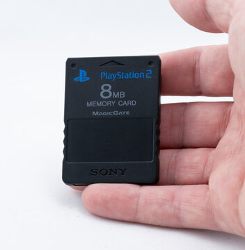 Gothenburg, Sweden - August 04 2024: Sony PlayStation 2 memory card held in hand demonstrating compact size.