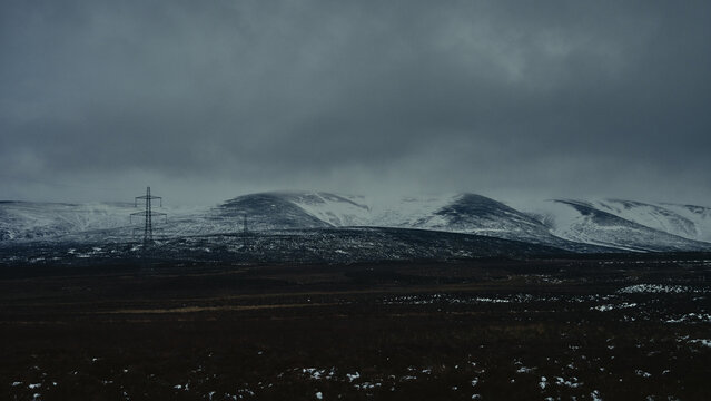 storm clouds over snowy mountains