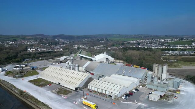 Par, Cornwall, England: DRONE VIEWS: Par Docks with the town of Par and Par Sands beach in the b/g. The Docks is a milling centre and also receives a slurry form of china clay for transporting.