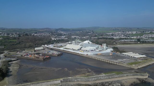 Par, Cornwall, England: DRONE VIEWS: Par Docks with the town of Par and Par Sands beach in the b/g. The Docks is a milling centre and also receives a slurry form of china clay for transporting.