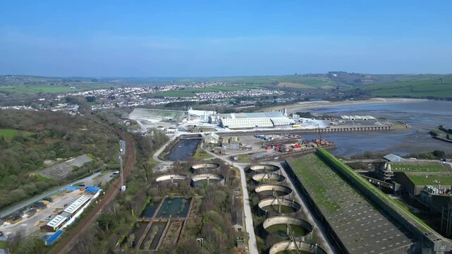 Par, Cornwall, England: DRONE VIEWS: Par Docks with the town of Par and Par Sands beach in the b/g. The Docks is a milling centre and also receives a slurry form of china clay for transporting.