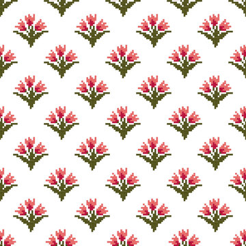 Seamless embroidery pattern of pink tulip flowers in cross stitch style.