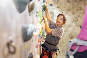Climbing gym encourages children to explore their strength and build confidence while climbing with support from caregivers © prelevicm