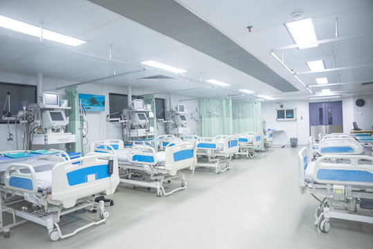 Modern hospital ward with empty blue beds in clean bright medical facility interior
