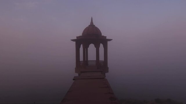 Scenic view of Brahmand Ghat on Yamuna river in Mathura, Uttar Pradesh during foggy morning. Historic riverside monument with peaceful spiritual atmosphere, showcasing Indian culture, heritage.