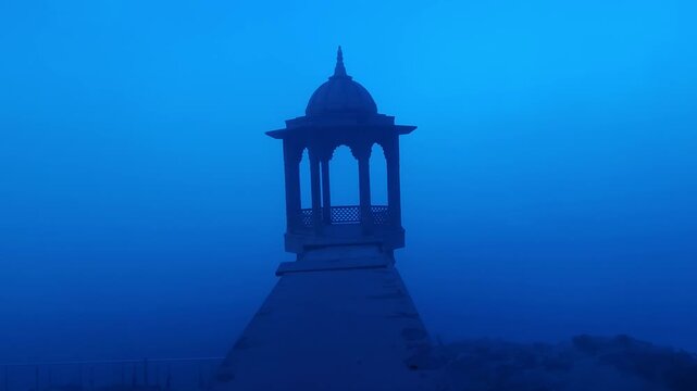 Scenic view of Brahmand Ghat on Yamuna river in Mathura, Uttar Pradesh during foggy morning. Historic riverside monument with peaceful spiritual atmosphere, showcasing Indian culture, heritage.