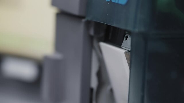 Operator take printed label extracted from a modern industrial printer