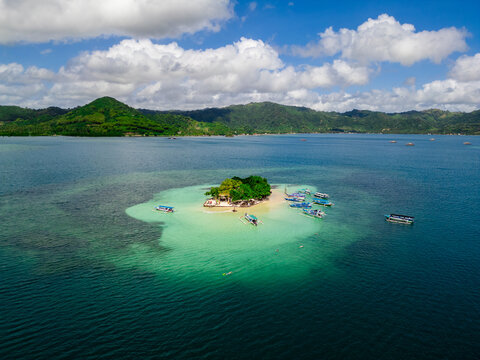 Serene Gili Sudak Island with Calm Turquoise Water and White Sand in Southwest Lombok