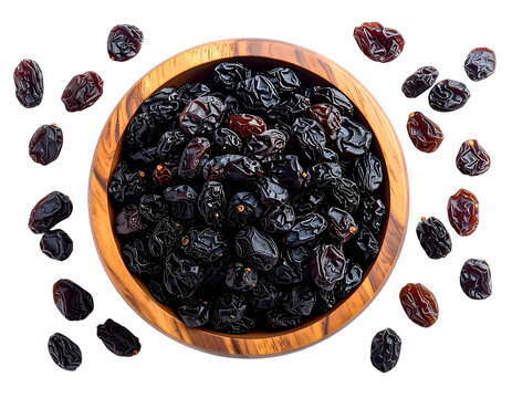 Dark, plump dried grapes piled high in a textured wooden bowl