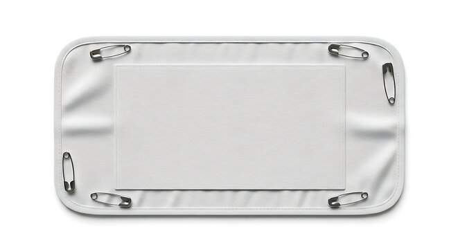 A blank white fabric rectangular patch with safety pins attached to its corners for fastening.
