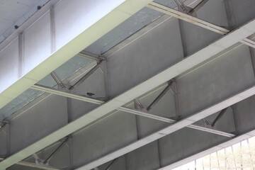 Fototapeta premium Industrial Ceiling with Ventilation Panels and Metal Grid Structure