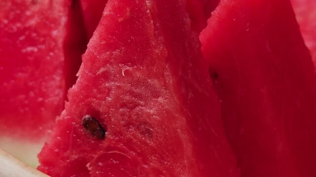 Place the watermelon halves on a plate.