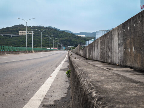 Aerial view of a multi-lane highway winding through lush green mountainous terrain in Taiwan.(22-03-2026)