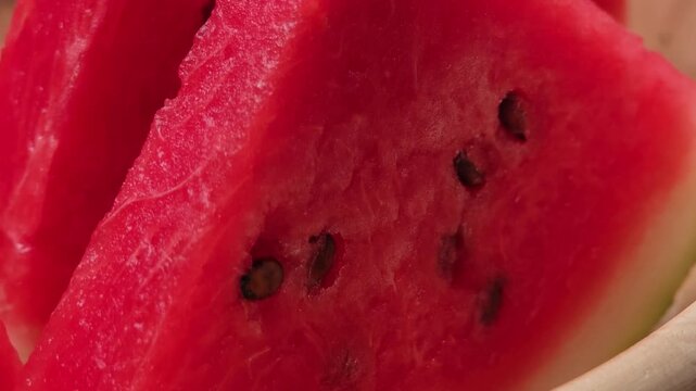 Place the watermelon halves on a plate.